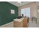 Bright home office features built-in shelving and a large window at 7132 W Trenton Way, Florence, AZ 85132