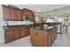 Spacious kitchen with granite countertops and dark wood cabinets at 7132 W Trenton Way, Florence, AZ 85132