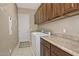 Convenient laundry room with washer, dryer, and cabinets at 7132 W Trenton Way, Florence, AZ 85132