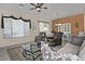 Bright living room with comfortable seating and a large window at 7132 W Trenton Way, Florence, AZ 85132