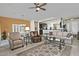 Spacious living room with comfortable seating and a view into the kitchen at 7132 W Trenton Way, Florence, AZ 85132