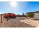 Landscaped backyard with gravel, mature plants, and a pergola-covered patio at 8039 E Madero Ave, Mesa, AZ 85209