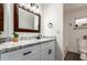Bathroom with granite countertop and modern vanity at 8039 E Madero Ave, Mesa, AZ 85209