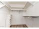Large walk-in closet with shelving and hanging rods at 8039 E Madero Ave, Mesa, AZ 85209