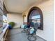 Relaxing covered porch with comfortable seating and natural light at 8039 E Madero Ave, Mesa, AZ 85209