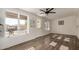 Sunlit living room with wood-look floors and backyard access at 8039 E Madero Ave, Mesa, AZ 85209