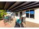 Relaxing patio with pergola and seating area, perfect for outdoor entertaining at 8039 E Madero Ave, Mesa, AZ 85209