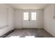 Unfinished storage room with double doors and white brick walls at 8039 E Madero Ave, Mesa, AZ 85209
