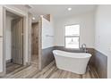 Spa-like bathroom with a freestanding soaking tub and walk-in shower at 0 N Bell Rd # 4, Queen Creek, AZ 85144