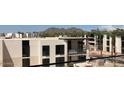 Aerial view of luxury homes with mountain backdrop and palm trees at 6587 N Palmeraie Blvd # 3031, Paradise Valley, AZ 85253
