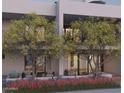Two story modern home with private balconies and lush landscaping at 6928 E 1St St, Scottsdale, AZ 85251