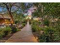 Landscaped walkway leading to a private courtyard at 10040 E Happy Valley Rd # 1, Scottsdale, AZ 85255