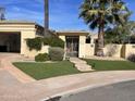 Beautiful desert home with artificial turf and gated entry at 10100 N 78Th Pl, Scottsdale, AZ 85258