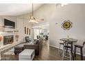 Open living space with fireplace, dining area, and kitchen view at 3017 W Sahuaro Dr, Phoenix, AZ 85029