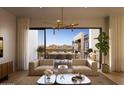 Living room with patio doors opening to mountain views at 19355 N 73Rd Way # 5026, Scottsdale, AZ 85255