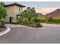 Gated community entrance with modern architecture and mountain views at 18720 N 101St St # 3009, Scottsdale, AZ 85255