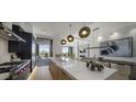 Modern kitchen with island and access to a patio at 37200 N Cave Creek Rd # 2120, Scottsdale, AZ 85262