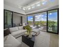 Living room with access to a large patio and scenic view at 37200 N Cave Creek Rd # 2120, Scottsdale, AZ 85262