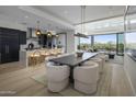 Open concept kitchen features modern cabinetry, island with seating, and high-end appliances at 37200 N Cave Creek Rd # 2120, Scottsdale, AZ 85262