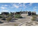 Contemporary home with stone and stucco exterior, desert landscaping at 8627 E Whisper Rock Trl # 120, Scottsdale, AZ 85266