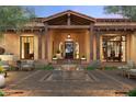 Elegant home entrance with a central fountain and inviting patio seating at 8510 E Tecolote Cir, Scottsdale, AZ 85266