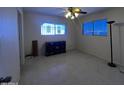 Bedroom with a dark wood cabinet and floor lamp at 211 W 6Th St, Eloy, AZ 85131