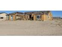 House under construction with wood framing visible at 1928 W Big Sky Ln, Queen Creek, AZ 85144