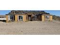 House under construction with wood framing visible at 1928 W Big Sky Ln, Queen Creek, AZ 85144