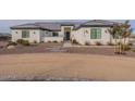 Modern two-story home with neutral exterior and landscaping at 1928 W Big Sky Ln, Queen Creek, AZ 85144