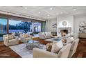 Elegant living room with hardwood floors and fireplace at 6940 E Indian Bend Rd, Paradise Valley, AZ 85253