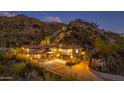 Night view of a stunning mountainside home with exterior lighting at 5339 E Desert Vista Rd, Paradise Valley, AZ 85253