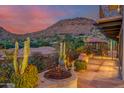Spacious patio with fire pit, mountain views, and ornate railing at 5339 E Desert Vista Rd, Paradise Valley, AZ 85253