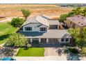 Two-story house with a large backyard, pool, and three-car garage at 1327 E Judi Dr, Casa Grande, AZ 85122