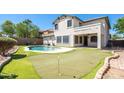 Relaxing backyard oasis with a pool and putting green at 1327 E Judi Dr, Casa Grande, AZ 85122