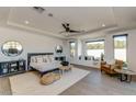 Spacious main bedroom with large windows and sitting area at 10535 E Paradise Dr, Scottsdale, AZ 85259