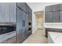 Modern kitchen with stainless steel appliances and marble countertops at 12140 N 106Th St, Scottsdale, AZ 85259