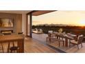 Spacious balcony with outdoor dining and mountain views at 4849 N Camelback Ridge Rd # A107, Scottsdale, AZ 85251