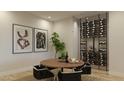Modern dining area with wine storage and round wooden table at 18720 N 101St St # 2005, Scottsdale, AZ 85255