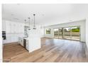 Open concept living room and kitchen area at 7583 W Gelding Dr, Peoria, AZ 85381