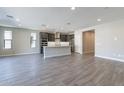 Modern kitchen with island and stainless steel appliances at 374 E Citrus Hollow Way, Queen Creek, AZ 85140