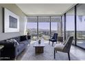 Sophisticated living room featuring floor-to-ceiling windows at 7180 E Kierland Blvd # 1115, Scottsdale, AZ 85254