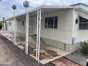 Mobile home with covered patio and steps at 7300 N 51St Ave # 208, Glendale, AZ 85301
