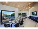 Modern dining area with patio access and scenic views at 41327 N 106Th St, Scottsdale, AZ 85262