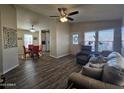 Open concept living and dining area with wood-look floors at 650 N Hawes Rd # 3423, Mesa, AZ 85207