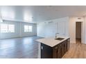 Open concept kitchen features dark cabinetry and quartz countertops at 3131 N Central Ave # 5012, Phoenix, AZ 85012