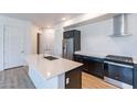 Modern kitchen with stainless steel appliances and an island at 3131 N Central Ave # 5012, Phoenix, AZ 85012
