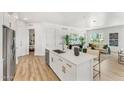 Modern kitchen with white cabinets, island, and stainless steel appliances at 3131 N Central Ave # 3018, Phoenix, AZ 85012
