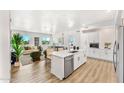 Modern kitchen with white cabinets, stainless steel appliances, and an island at 3131 N Central Ave # 3018, Phoenix, AZ 85012