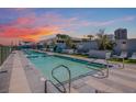 Community pool with lounge area at 3131 N Central Ave # 3018, Phoenix, AZ 85012