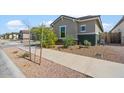 Side view of the house showcasing neat landscaping and a walkway at 21088 E Arroyo Verde Dr, Queen Creek, AZ 85142